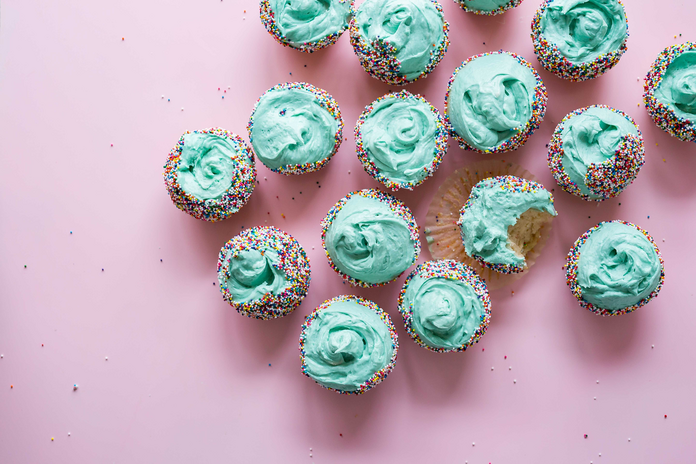 cupcakes with blue icing and sprinkles