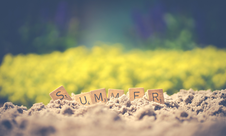 Summer spelled out on soil