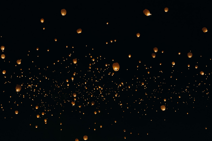 Floating Lanterns at night by unsplash