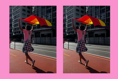 person walking with rainbow flag