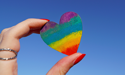 photo of person holding multicolored heart decor 1173576