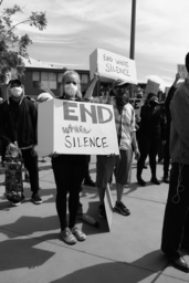 Protesters with \"End White Silence\" signs
