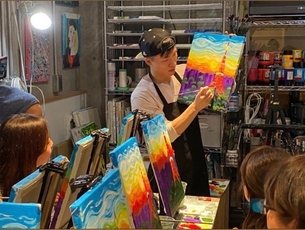 teaching painting to a few students in Tokyo