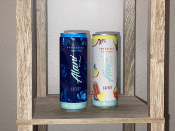 Updated copy of my photo of two Alani Nu energy drinks.