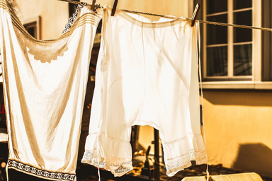 white laundry hanging to dry during golden hour
