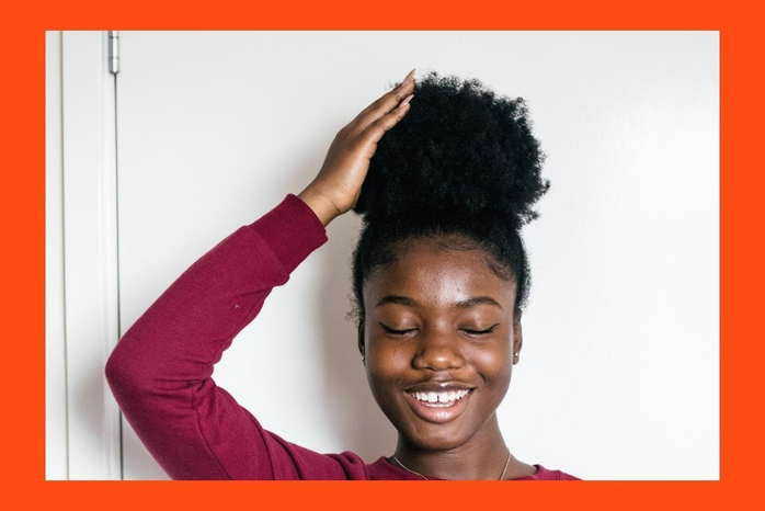 4 Things to Do Tonight to Wake Up With Flawless Hair Tomorrow 5 woman touching hair