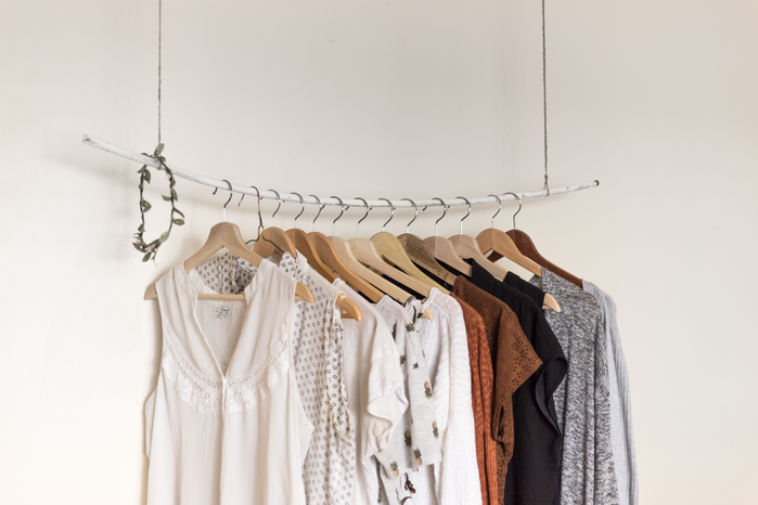 clothes hanging on a rack by Priscilla Du Preez on Unsplash