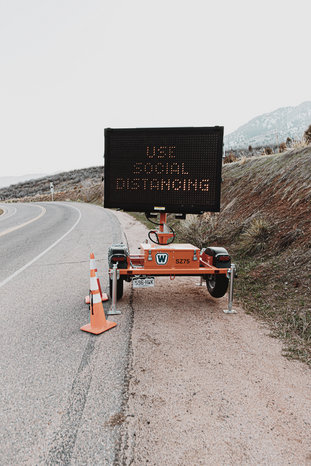social distancing traffic sign from Unsplash