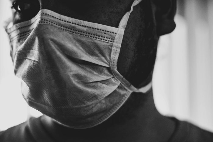 person wearing mask by Tais Captures on Unsplash