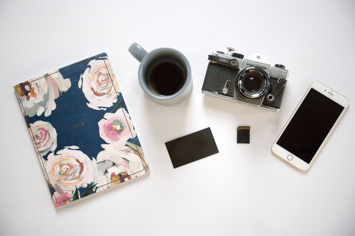 notebook, coffee, film camera