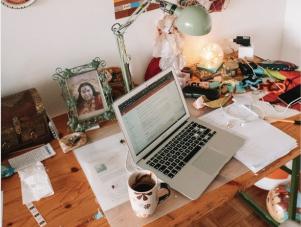 work space with computer and coffee mug