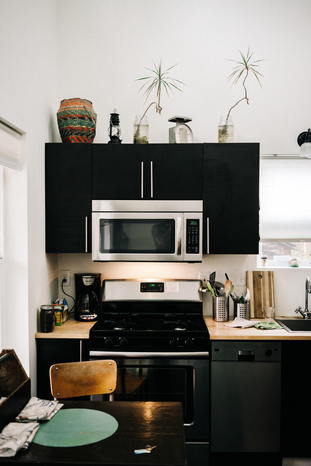 Kitchen with microwave and stove by Mike Marquez on Unsplash