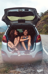 Picture of two friends in back of car