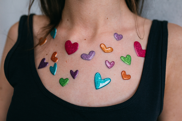 heart stickers on chest by Viktoria Slowikowska