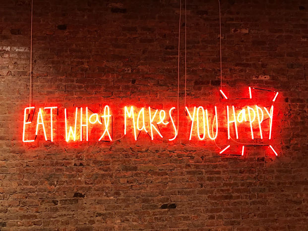 Eat what makes you happy neon sign by Jon Tyson