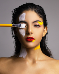 Woman with red lips with yellow and white paint on her face.