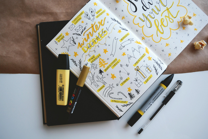 yellow and black ink drawings in bullet journal