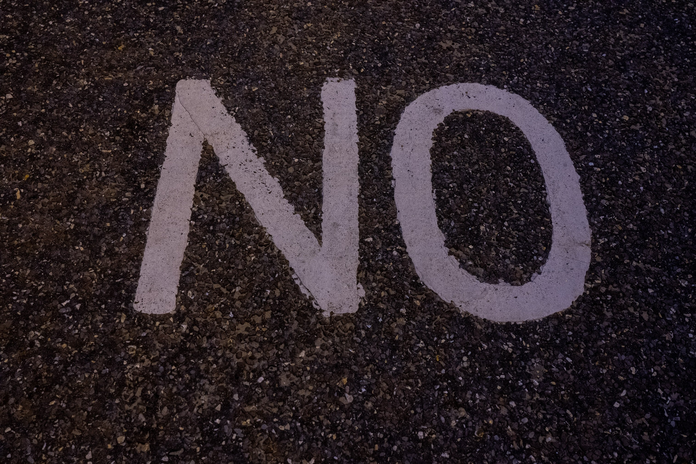 the word \"no\" painted on the road