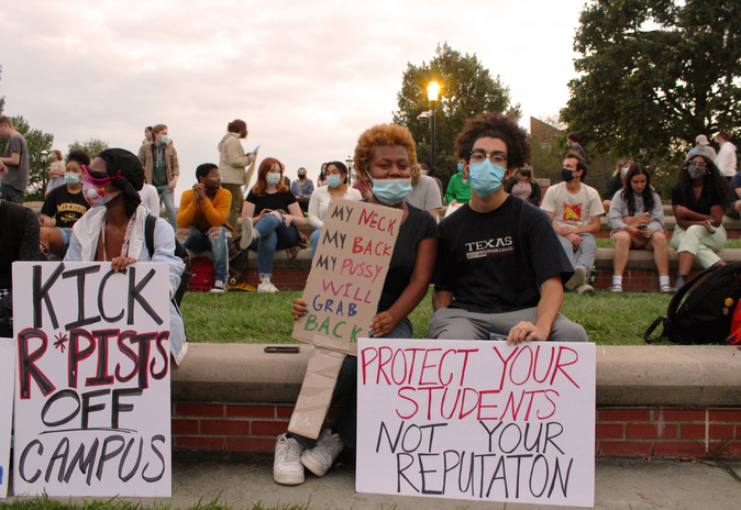 Student protestors in Columbia, Mo., hold signs at a protest against sexual assault and rape on campus.