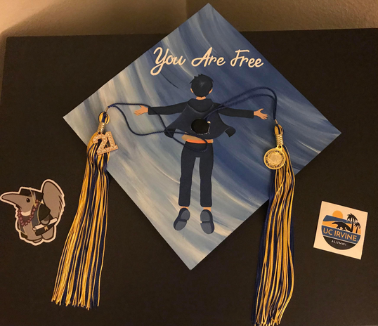 Graduation cap with stickers and tassels