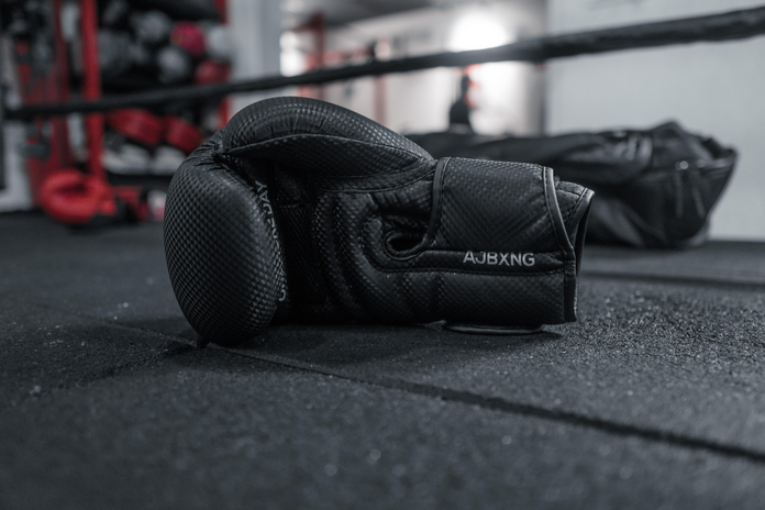 black boxing gloves in a practice boxing