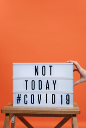 COVID sign with orange background