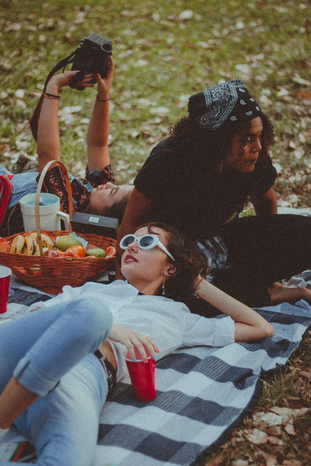 friends having picnic in the park by Aline Viana Prado
