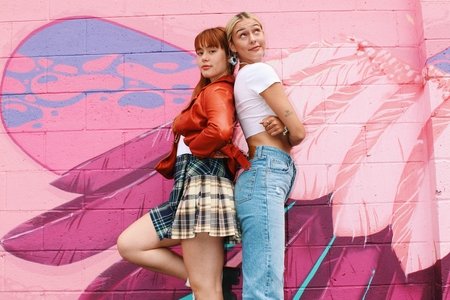 Martha and Logan standing back to back at their pop-up in Kingston