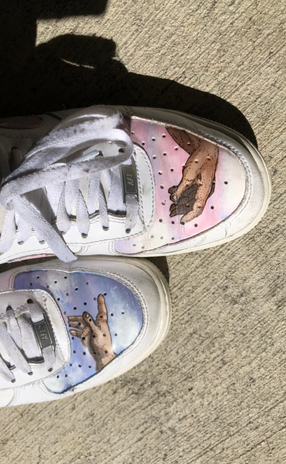 Shoes with michaelangelos hands painted on them