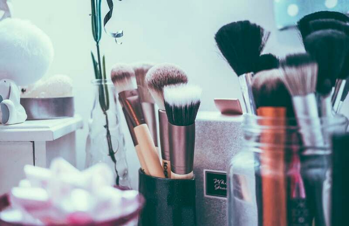 Makeup brushes on countertop.