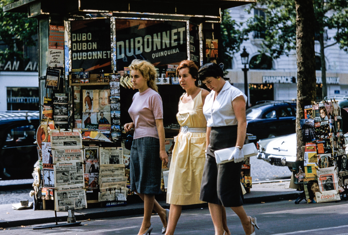 three women walking down the street