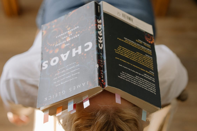 Girl with book on her head