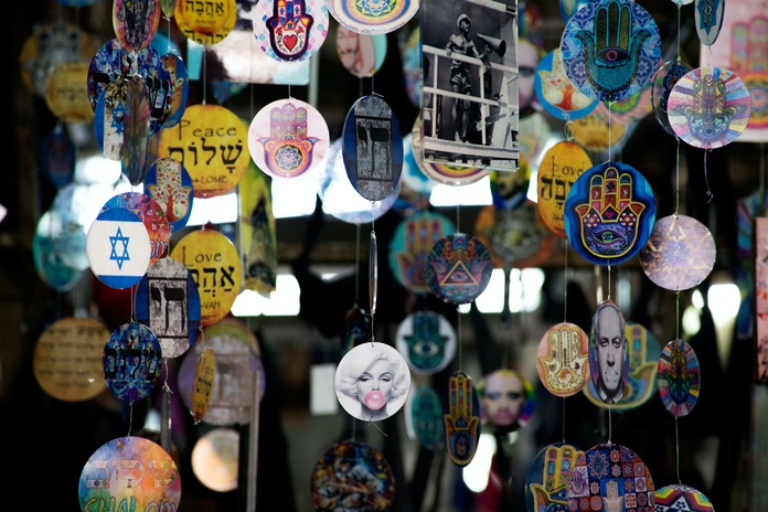 picture of decorations showing peace, the Hand of Hamsa, Netanyahu and other recognizable faces or phrases.