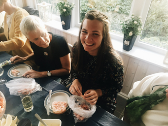girl peeling shrimp in Norway