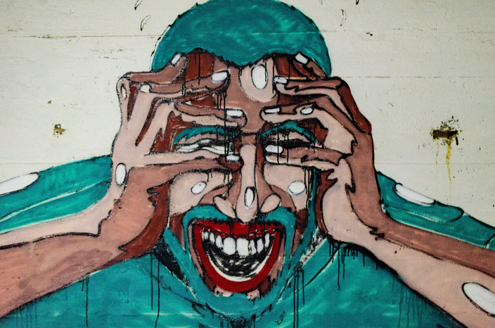 stressed man graffiti art by Aaron Blanco Tejedor Unsplash