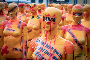 Mannequins covered in paint and tape with words such as \'justice\' written on them