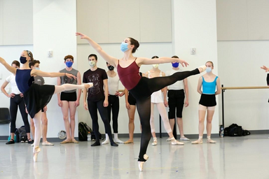Lydia Morris and dancers in arabesque in ballet class