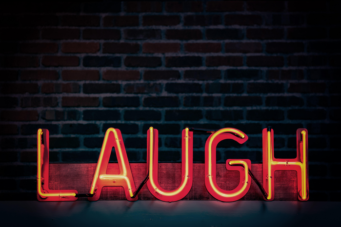 Laugh sign by Tim Mossholder
