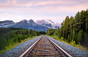 Sunset View of Canadian Rockies and Railway Track at Lake Louise