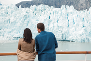 People enjoying the view on the deck of an Alaska Cruise ship