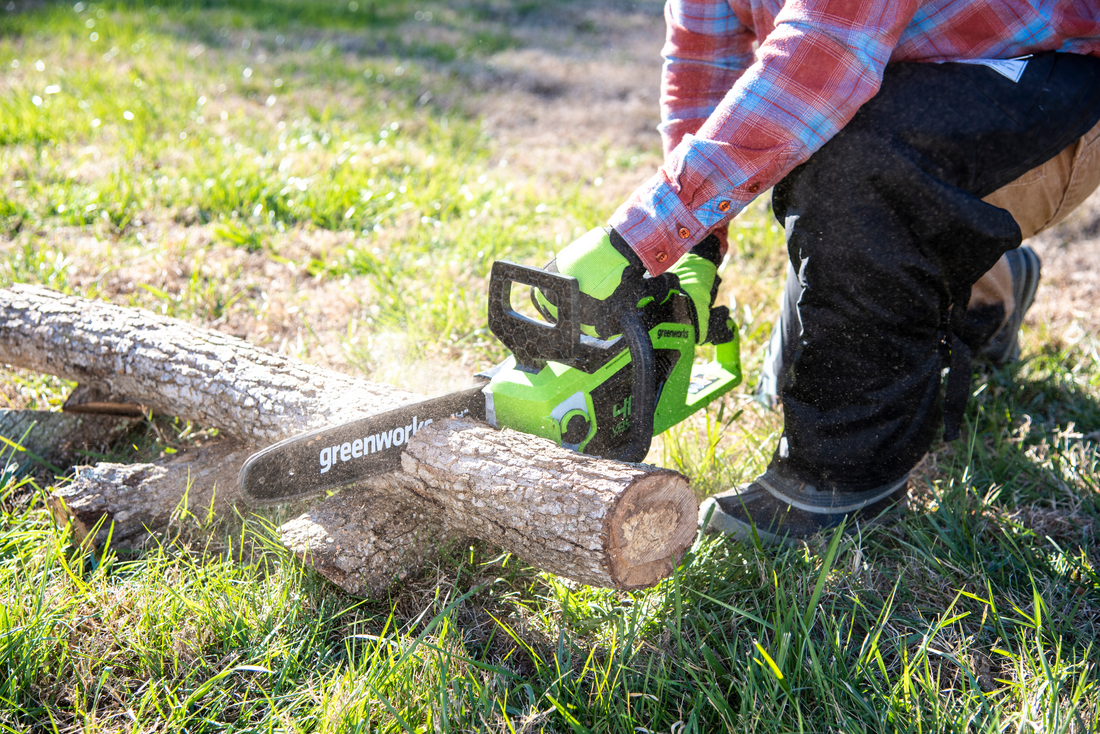 men cutting with chainsaw