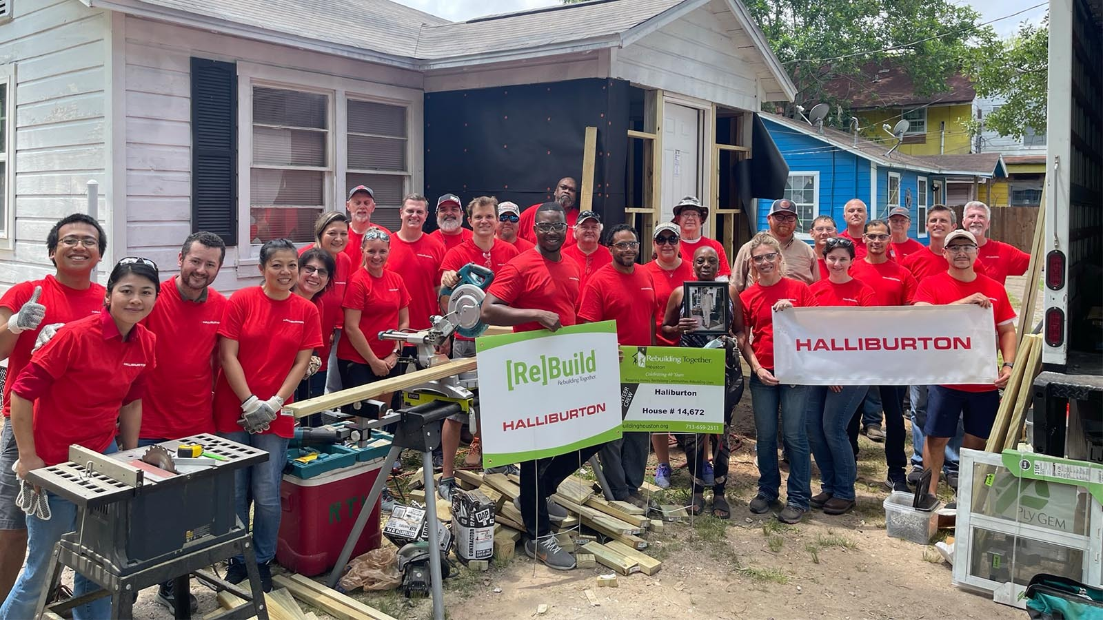 Volunteer group photo with the home owner, Ms.Gatterson.