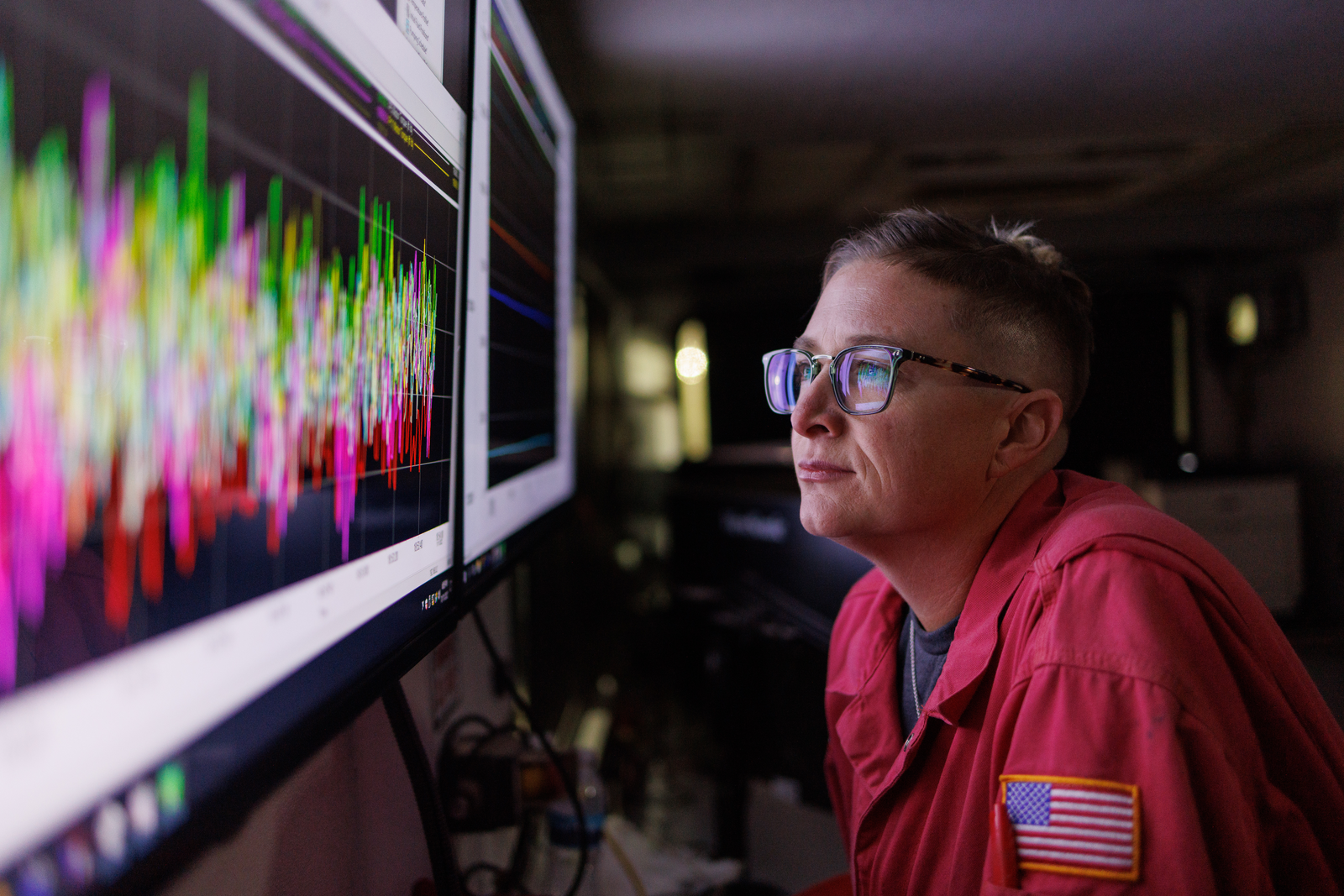 Halliburton employee looking at screen displaying analytics 