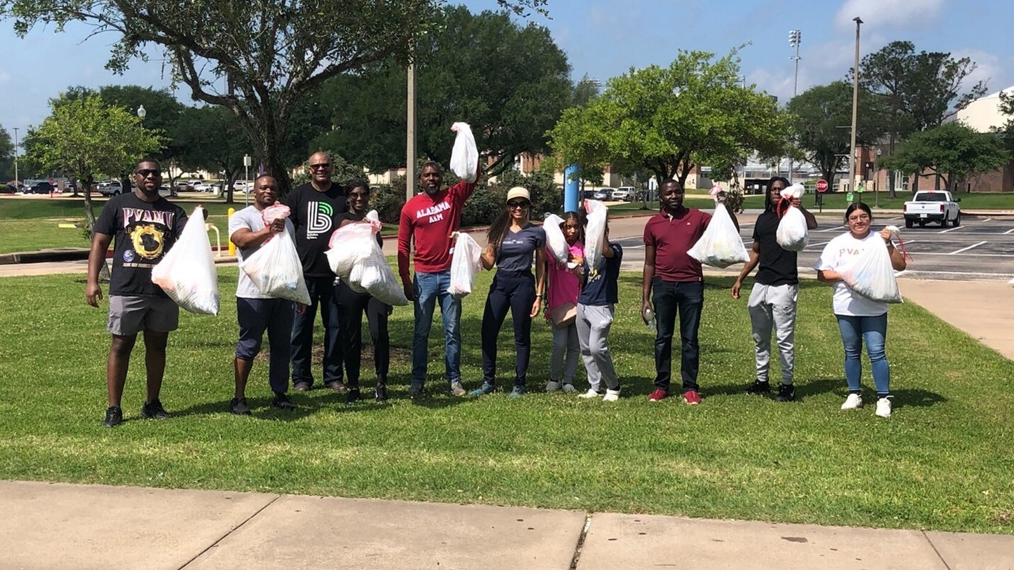 Halliburton employees and RISE scholars at PVAMU campus clean up.