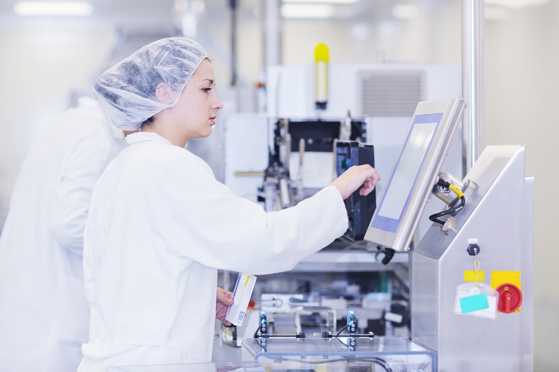 Man in Warehouse looking a tablet working